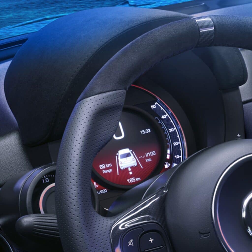 Sports steering wheel in leather and Alcantara® with carbon fibre detailing in the Abarth 695